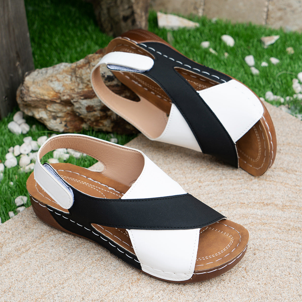 Black cross-strap wedge sandals