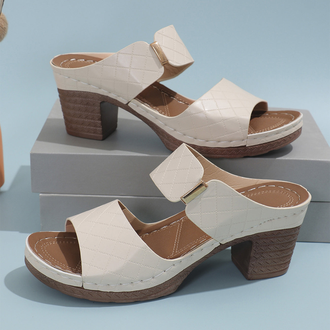 Chunky heel slide sandals worn with a summer outfit