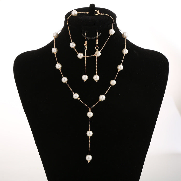 Gold-tone pearl necklace, earrings and bracelet set