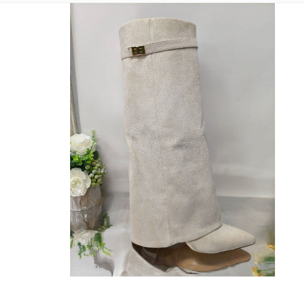 Side profile showing the block heel and calf shaft