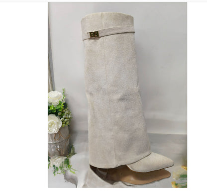 Side profile showing the block heel and calf shaft